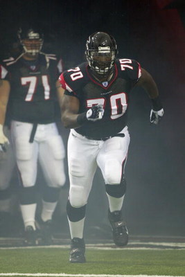 ATLANTA - SEPTEMBER 14: Tackle Bob Whitfield #70 of the Atlanta Falcons runs onto the field during introductions prior to a game against the Washington Redskins on September 14, 2003 at the Georgia Dome in Atlanta, Georgia. The Redskins defeated the Falc