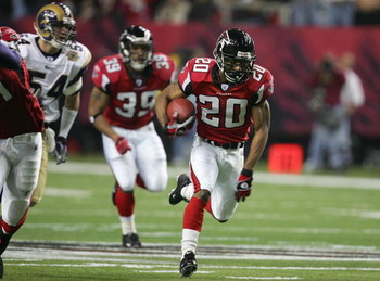 ATLANTA - JANUARY 15: Allen Rossum #20 of the Atlanta Falcons runs against the defense of the St. Louis Rams during first half of the NFC Divisional Playoff game at the Georgia Dome on January 15, 2005 in Atlanta, Georgia. (Photo by Streeter Lecka/Getty