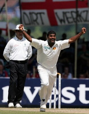 KANDY, SRI LANKA - DECEMBER 03:  Sri Lankan bowler Muttiah Muralitharan celebrates after taking his World Record 709th Test wicket, that of England batsman Paul Collingwood, during the third day of the First Test match between Sri Lanka and England at Asg