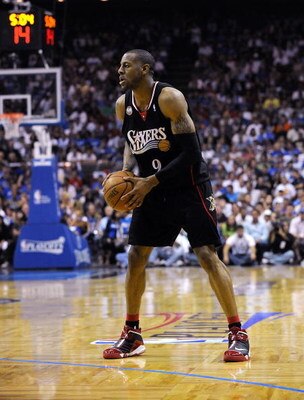 ORLANDO, FL - APRIL 22:  Andre Iguodala #9 of the Philadelphia 76ers sets up the offense against the Orlando Magic watch a foul shot during Game Two of the Eastern Conference Quarterfinals during the 2009 NBA Playoffs at Amway Arena April 22, 2009 in Orla