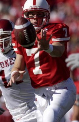 27 Oct 2001 : Quarterback Eric Crouch of Nebraska shovel passes the ball under pressure of Oklahoma during the game at Memorial Stadium in Lincoln, Nebraska. The Nebraska Cornhuskers won 20-10. DIGITAL IMAGE. Mandatory Credit: Elsa/Allsport