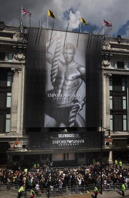 LONDON, ENGLAND - JUNE 11:  Footballer David Beckham unveils a giant poster of himself advertising Armani underwear on the side of Selfridges department store on June 11, 2009 in London, England. The poster is the latest in  a series of high-profile adver