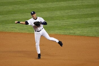 NEW YORK - SEPTEMBER 21:  Derek Jeter #2 of the New York Yankees fields the ball against the Baltimore Orioles during the last regular season game at Yankee Stadium on September 21, 2008 in the Bronx borough of New York City. The Yankees are playing their