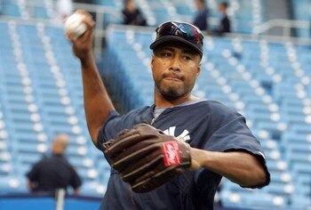 NEW YORK - OCTOBER 03:  Bernie Williams #51 of the New York Yankees throws during batting practice prior to the start of game one of the American League Division Series against the Detroit Tigers on October 3, 2006 at Yankee Stadium in the Bronx Borough o
