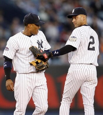 NEW YORK  - APRIL 17: Robinson Cano #24 (L) and Derek Jeter #2 (R) of the New York Yankees reacts after a play in the first inning of a game against the Boston Red Sox on April 17, 2008 at Yankee Stadium in the Bronx borough of New York City. (Photo by Je