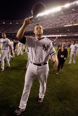 NEW YORK - SEPTEMBER 21: Joba Chamberlain #62 of the New York Yankees waves to fans after the last regular season game at Yankee Stadium on September 21, 2008 in the Bronx borough of New York City. The Yankees are playing their final season in the 85 year
