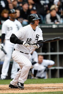 CHICAGO - OCTOBER 05:  A.J. Pierzynski #12 of the Chicago White Sox hits a RBI single in the bottom of the third inning against the Tampa Bay Rays in Game Three of the ALDS during the 2008 MLB Playoffs at U.S. Cellular Field on October 5, 2008 in Chicago,