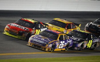 DAYTONA BEACH, FL - FEBRUARY 07:  Jamie McMurray, driver of the #26 Crown Royal Ford, races with Jeff Gordon, driver of the #24 DuPont Chevrolet, Kevin Harvick, driver of the #29 Shell/Pennzoil Chevrolet, and Jimmie Johnson, driver of the #48 Lowe's Chevr