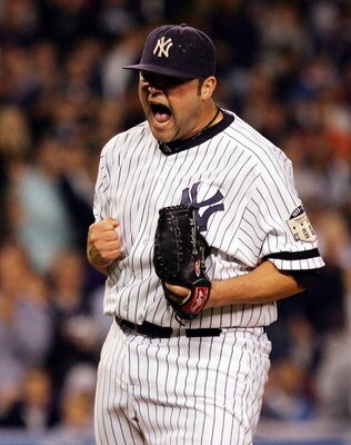 NEW YORK - SEPTEMBER 19:  Joba Chamberlain #62 of the New York Yankees reacts after striking out the side in the eigth inning against the Baltimore Orioles on September 19, 2008 at Yankee Stadium in the Bronx borough of New York City. The Yankees defeated