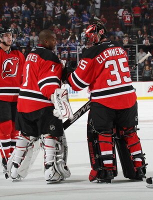 NEWARK, NJ - NOVEMBER 12: Goaltenders Kevin Weekes #1 and Scott Clemmensen #35 of the New Jersey Devils meet at the end of their combined 5-2 loss to the New York Rangers on November 12, 2008 at the Prudential Center in Newark, New Jersey. (Photo by Bruce
