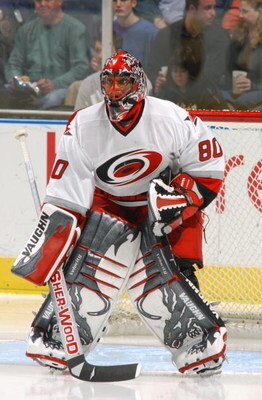 ATLANTA - MARCH 5:  Kevin Weekes #80 of the Carolina Hurricanes eyes the play from the top of the crease against the Atlanta Thrashers on March 5, 2004 at Philips Arena in Atlanta, Georgia.  The Hurricanes defeated the Thrashers 3-2.  (Photo by Scott Cunn