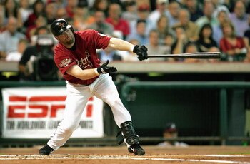 HOUSTON - OCTOBER 10:  Jeff Bagwell #5 of the Houston Astros swings the bat during game four of the National League Division Series against the Atlanta Braves at Minute Maid Park on October 10, 2004 in Houston, Texas.  The Braves won 6-5.  (Photo by Ronal