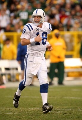 GREEN BAY, WI - OCTOBER 19:  Quarterback Peyton Manning #18 of the Indianapolis Colts runs off the field during  the game against the Green Bay Packers on October 19, 2008 at Lambeau Field in Green Bay Wisconsin. The Packers won 34-14.  (Photo by Stephen 