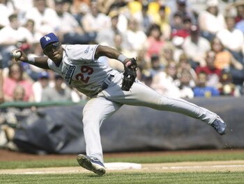 PITTSBURGH, PA - MAY 9:  Adrian Beltre #29 of the Los Angeles Dodgers tries to get a throw to first against the Pittsburgh Pirates on May 9, 2004 at PNC Park in Pittsburgh, Pennsylvania. (Photo by Rick Stewart/Getty Images)