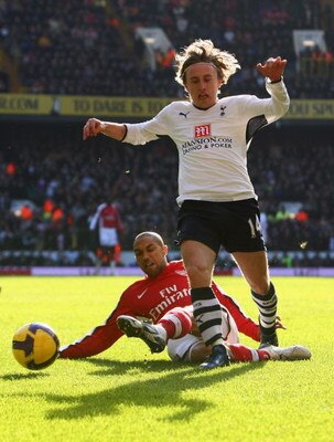 LONDON - FEBRUARY 08:  Luka Modric of Tottenham Hotspur is challenged by Gael Clichy of Arsenal during the Barclays Premier League match between Tottenham Hotspur and Arsenal at White Hart Lane on February 8, 2009 in London, England.  (Photo by Mike Hewit