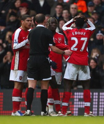 LONDON - FEBRUARY 08:  Emmanuel Eboue of Arsenal can't believe it as he is sent off  by referee Mike Dean during the Barclays Premier League match between Tottenham Hotspur and Arsenal at White Hart Lane on February 8, 2009 in London, England.  (Photo by 