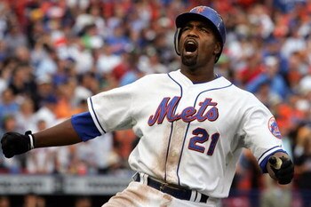 NEW YORK - SEPTEMBER 28:  Carlos Delgado #21 of the New York Mets reacts after flying out in the eighth inning against the Florida Marlins during the last regular season baseball game ever played in Shea Stadium on September 28, 2008 in the Flushing neigh
