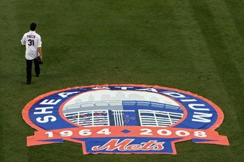 NEW YORK - SEPTEMBER 28:  Former Mets catcher Mike Piazza walks on the field in a post game ceremony after the last regular season baseball game ever played in Shea Stadium against the Florida Marlins on September 28, 2008 in the Flushing neighborhood of 