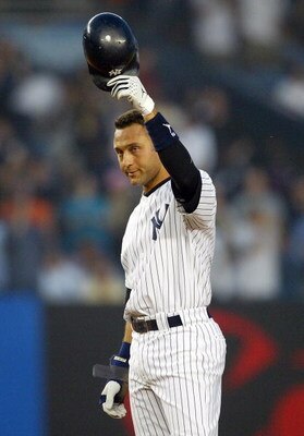 NEW YORK - MAY 26:  Derek Jeter #2 of the New York Yankees acknowledges the crowd after his fourth inning base hit against the Kansas City Royals at Yankee Stadium on May 26, 2006 in the Bronx borough of New York City. The hit was Jeter's 2,000 career hit