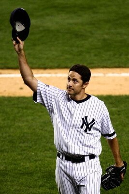 NEW YORK - SEPTEMBER 18:  Mike Mussina #35 of the New York Yankees waves to the crowd after being taken out of the game in the seventh inning against the Chicago White Sox on September 18, 2008 at Yankee Stadium in the Bronx borough of New York City.  (Ph