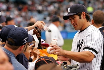 NEW YORK - APRIL 28:  Johnny Damon #18 of the New York Yankees signs autographs for fans before the game against the Boston Red Sox at Yankee Stadium on April 28, 2007 in the Bronx borough of New York City.  (Photo by Chris Trotman/Getty Images)