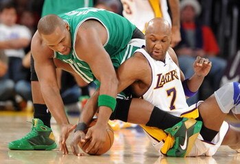 LOS ANGELES, CA - DECEMBER 25:   Glen Davis #11 of the Boston Celtics and Lamar Odom #7 of the Los Angeles Lakers battle for possession of the ball at Staples Center on December 25, 2008 in Los Angeles, California.  The Lakers defeated the Celtics 92-83. 