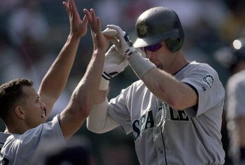 30 Sep 2000:  Jay Buhner #19 of the Seattle Mariners high fives Alex Rodriguez #3 as he moves to the dugout during the game against the Anaheim Angels at Edison Field in Anaheim, California. The Mariners defeated the Angels 21-9.Mandatory Credit: Jeff Gro