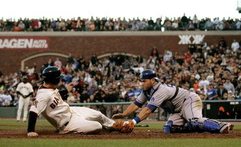 SAN FRANCISCO - AUGUST 9:  Catcher Russell Martin #55 of the  Los Angeles Dodgers tags infielder John Bowker #21 of the San Francisco Giants at AT&T Park on August 9, 2008 in San Francisco, California. (Photo by Max Morse/Getty Images)