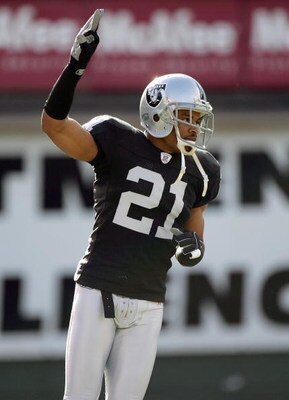 OAKLAND, CA - DECEMBER 17:  Nnamdi Asomugha #21 of the Oakland Raiders signals on the field during an NFL game against the St. Louis Rams at McAfee Coliseum December 17, 2006 in Oakland, California. (Photo by Jed Jacobsohn/Getty Images)