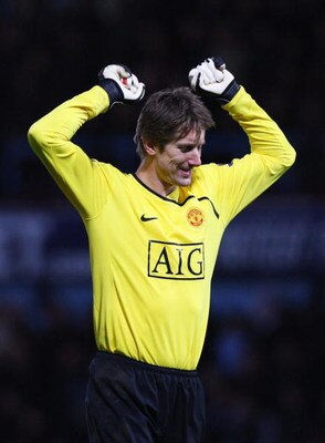 LONDON - FEBRUARY 08:  Goalkeeper Edwin Van der Sar of Manchester United celebrates Ryan Giggs' opening goal during the Barclays Premier League match between West Ham United and Manchester United at Upton Park on February 8, 2009 in London, England.  (Pho