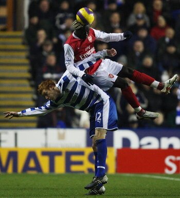 READING, UNITED KINGDOM - NOVEMBER 12: David Kitson of Reading is beaten to the header by Bacary Sanga of Arsenal during the Barclays Premier League match between Reading and Arsenal at Madejski Stadium on November 12, 2007 in Reading, England.  (Photo by