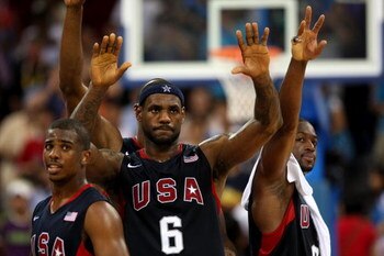 BEIJING - AUGUST 22:  (L-R) Chris Paul #13, LeBron James #23 and Dwyane Wade #9 of the United States celebrate after their win against Argentina during a men's semifinal baketball game at the Wukesong Indoor Stadium on Day 14 of the Beijing 2008 Olympic G