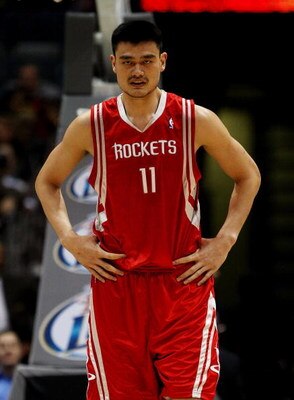 MILWAUKEE - FEBRUARY 09: Yao Ming #11 of the Houston Rockets watches as a teammate shoots a free-throw against the Milwaukee Bucks on February 9, 2009 at the Bradley Center in Milwaukee, Wisconsin. The Bucks defeated the Rockets 124-112. NOTE TO USER: Use