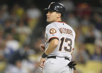 LOS ANGELES, CA - SEPTEMBER 19:   Omar Vizquel #13 of the San Francisco Giants looks on as he runs home to score in the fifth inning against the Los Angeles Dodgers at Dodger Stadium on September 19, 2008 in Los Angeles, California.  (Photo by Lisa Blumen
