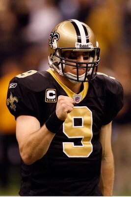 NEW ORLEANS - DECEMBER 28:  Quarterback Drew Brees #9 of the New Orleans Saints pumps his fist during the game against the Carolina Panthers on December 28, 2008 at the Superdome in New Orleans, Louisiana.  (Photo by Chris Graythen/Getty Images)