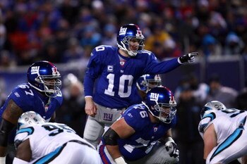EAST RUTHERFORD, NJ - DECEMBER 21:  Quarterback Eli Manning #10 of the New York Giants signals before the snap against the Carolina Panthers on December 21, 2008 at Giants Stadium in East Rutherford, New Jersey.  (Photo by Chris McGrath/Getty Images)
