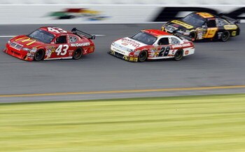 DAYTONA BEACH, FL - FEBRUARY 12:  Reed Sorenson,driver of the #43 McDonald's Dodge, races Travis Kvapil, driver of the #28 Golden Corral Ford, and Elliott Sadler, driver of the #19 Stanley Dodge, during the NASCAR Sprint Cup Series Gatorade Duel 2 at Dayt