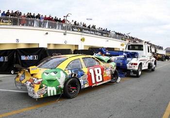 DAYTONA BEACH, FL - FEBRUARY 15:  The #18 M&M's Toyota driven by Kyle Busch is towed into the garage after being damaged during the NASCAR Sprint Cup Series Daytona 500 at Daytona International Speedway on February 15, 2009 in Daytona Beach, Florida.  (Ph