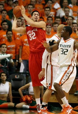 CORAL GABLES, FL - DECEMBER 02:  B.J. Mullens #32 of the Ohio State Buckeyes looks to pass over the top of Brian Asbury #32 of the Miami Hurricanes at BankUnited Center on December 2, 2008 in Coral Gables, Florida. Ohio State defeated Miami 73-68.  (Photo