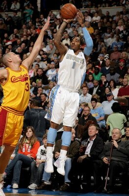 DENVER - DECEMBER 19:  J.R. Smith #1 of the Denver Nuggets takes a shot over Aleksandar Pavlovic #3 of the Cleveland Cavaliers at the Pepsi Center on December 19, 2008 in Denver, Colorado.The Cavaliers defeated the Nuggets 105-88.  (Photo by Doug Pensinge