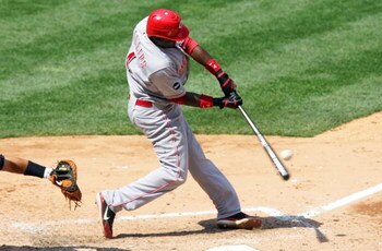 NEW YORK - JUNE 21:  Brandon Phillips #4 of the Cincinnati Reds hits a two run single in the eigth inning against the New York Yankees on June 21, 2008 at Yankee Stadium in the Bronx borough of New York City. The Reds won the game 6-0.  (Photo by Jim McIs