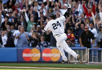 NEW YORK - SEPTEMBER 20:  Robinson Cano #24 of the New York Yankees celebrates his game winning base hit in the ninth inning against the Baltimore Orioles on September 20, 2008 at Yankee Stadium in the Bronx borough of New York City. The Yankees defeated 