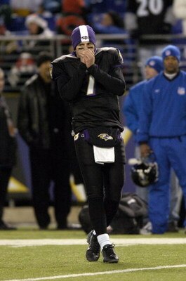 BALTIMORE - DECEMBER 3:  Kyle Boller #7 of the Baltimore Ravens blows into his hands during warm-ups before the game against the New England Patriots at M&T Bank Stadium December 3, 2007 in Baltimore, Maryland.  (Photo by Greg Fiume/Getty Images)