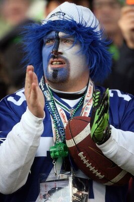 SEATTLE - JANUARY 05:  A Seattle Seahawks fan cheers on his team during the game against the Washington Redskins during the NFC Wild Card game at Qwest Field on January 5, 2008 in Seattle, Washington. The Seahawks defeated the Redskins 35-14.  (Photo by O