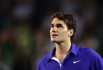 MELBOURNE, AUSTRALIA - FEBRUARY 01:  Roger Federer of Switzerland shows his emotion during the trophy presentation after his men's final match against Rafael Nadal of Spain during day fourteen of the 2009 Australian Open at Melbourne Park on  February 1, 