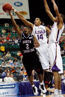 ATLANTA - MARCH 13:  Devan Downey #2 of the South Carolina Gamecocks has a shot blocked by Garrett Temple #14 of the Louisiana State University Tigers during the SEC Basketball Tournament on March 13, 2008 at the Georgia Dome in Atlanta, Georgia.  (Photo 