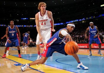 DENVER - FEBRUARY 20:   Allen Iverson #3 of the Eastern Conference All-Stars reaches for a loose ball under pressure from Dirk Nowitzki #41 of the Western Conference All-Stars during the 54th All-Star Game, part of 2005 NBA All-Star Weekend at Pepsi Cente