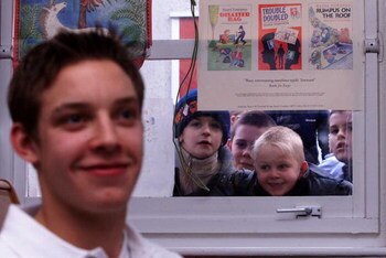 25 Jan 2001:  Alan Smith of Leeds United gives an interview to the press as the children of Middleton Primary School look through the window to get a glimpse of their hero during a Nike soccer coaching clinic held at Middleton Primary School in Leeds. Man