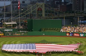 PITTSBURGH - JULY 11:  An American flag in the shape of the U.S.A. is displayed on the field before the 77th MLB All-Star Game at PNC Park on July 11, 2006 in Pittsburgh, Pennsylvania.  (Photo by Jamie Squire/Getty Images)