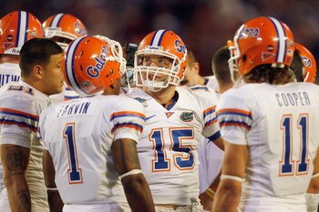 MIAMI - JANUARY 08:  Quarterback Tim Tebow #15 of the Florida Gators huddles against the Oklahoma Sooners during the FedEx BCS National Championship Game at Dolphin Stadium on January 8, 2009 in Miami, Florida.  (Photo by Eliot J. Schechter/Getty Images